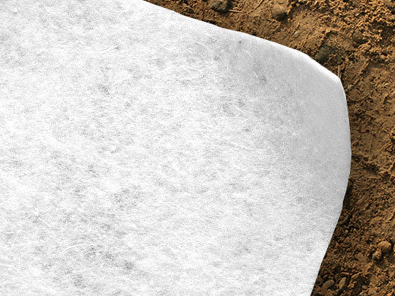 non woven white geotexile membrane laid on sand